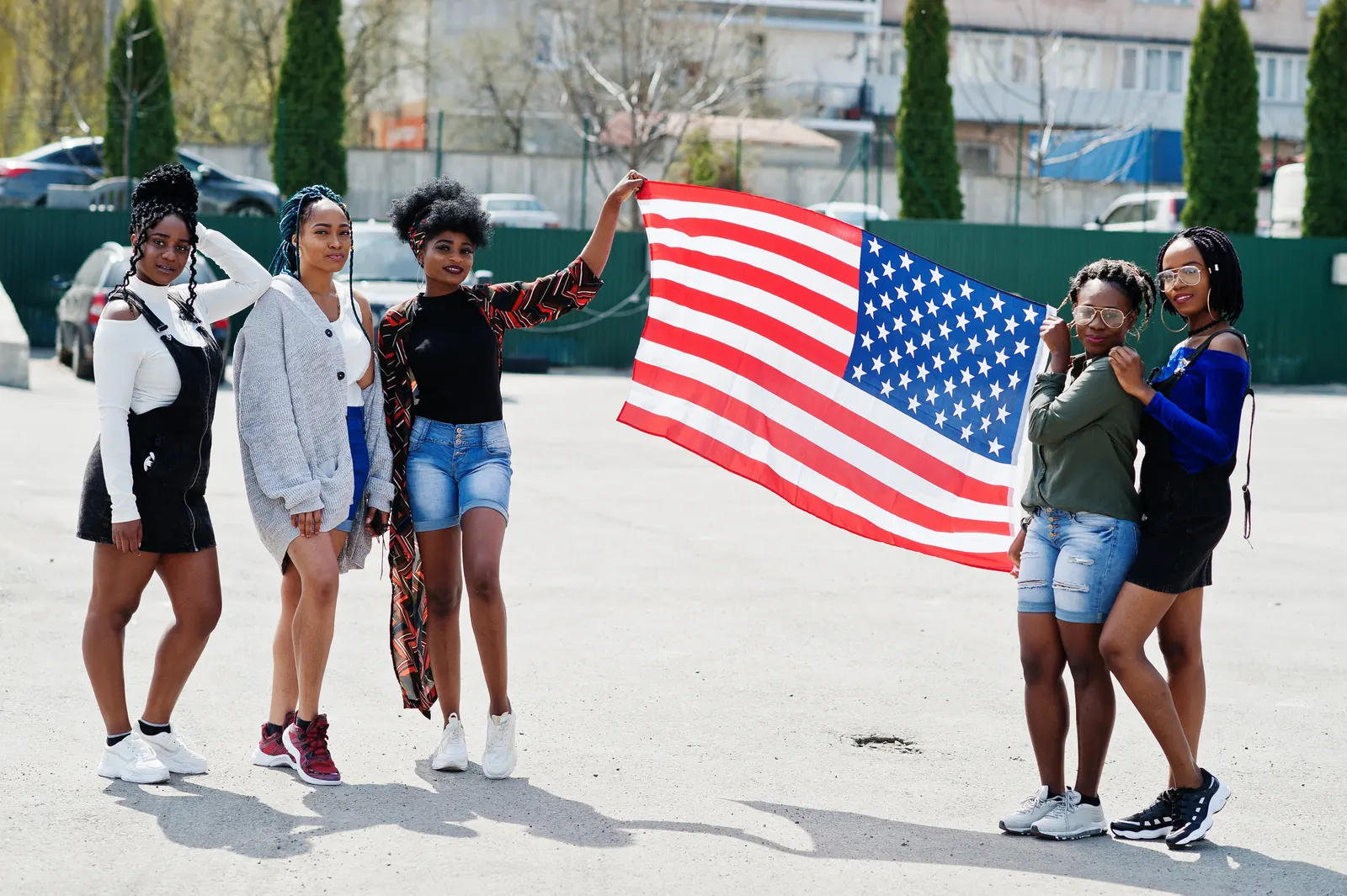 Students walking together with a United States flag